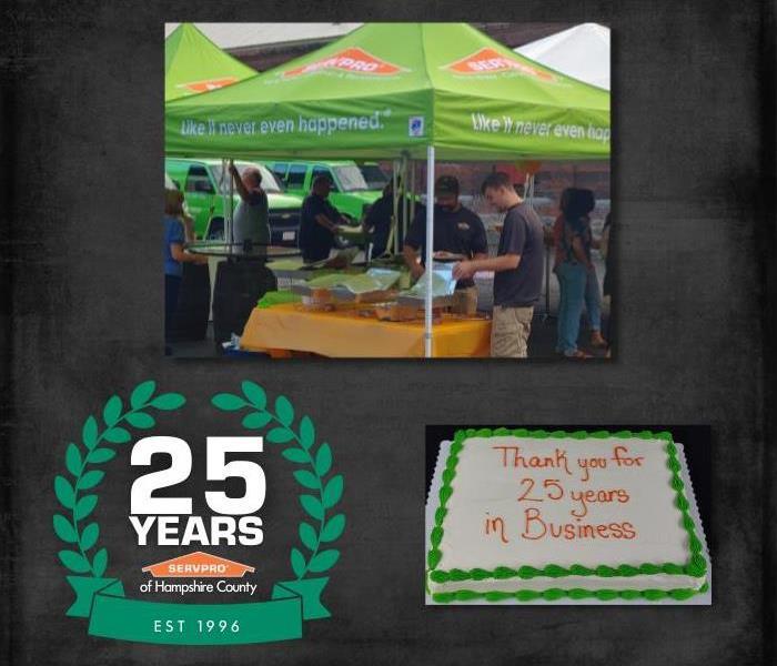 People getting food under a SERVPRO tent