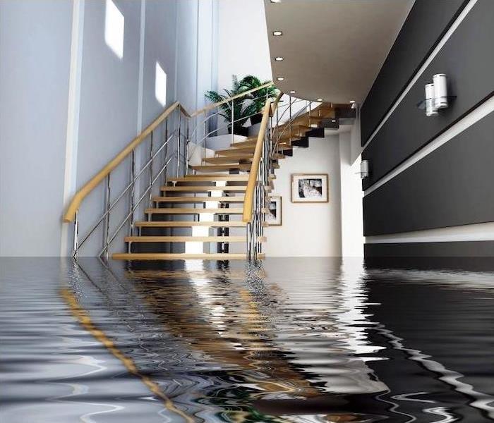 Flood waters under stairs in home