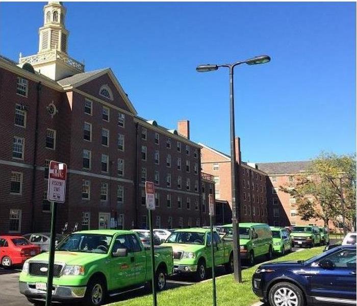 SERVPRO vehicles in front of buildings